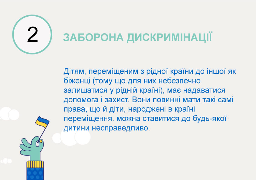 hand som håller ukrainsk flagga med text på ukrainska om artikel 2